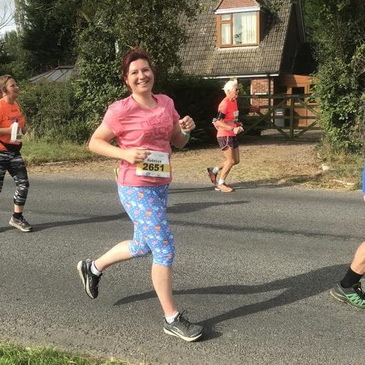 Becci running to champion mental health showing how Whitby Running Club can make you feel good and happy